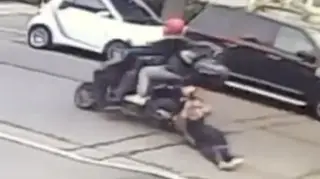Woman dragged by moped thieves