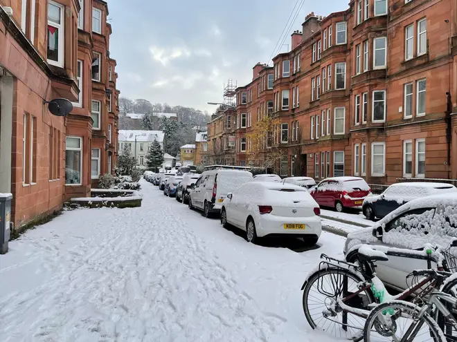 Snow in Glasgow, as scattered weather warnings for snow and ice are in place across the UK as temperatures plunged below freezing overnight.