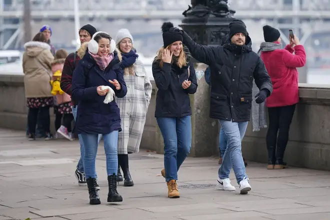 People walking along Embankment in London on Saturday