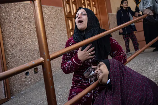 Palestinians mourn their relatives killed in the Israeli bombardment of Khan Younis