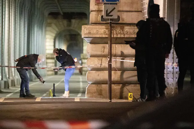 Police at the scene after a German tourist was killed and a British man injured in a 'terror' attack in Paris