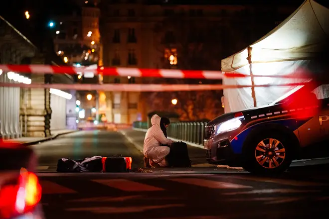 Police at the scene after a German tourist was killed and a British man injured in a 'terror' attack in Paris