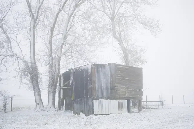 A derelict barn sits in the fog and snow at Mill Farm on December 02, 2023 in Bodsham, United Kingdom
