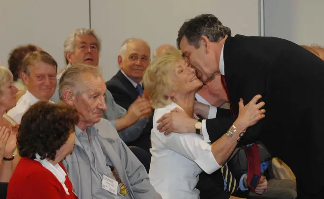 Gordon Brown kisses Glenys Kinnock at a Labour Party leadership Welsh hustings in Cardiff.