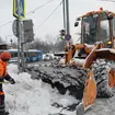 Municipal workers clear snow from pavements in Moscow
