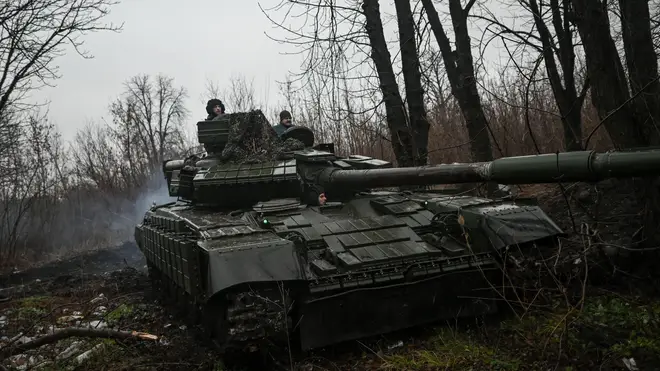 A T-64 main battle tank moves through a town, in the Donetsk Region of Eastern Ukraine.