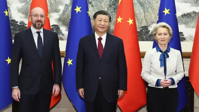 Chinese President Xi Jinping, centre, stands for a group photograph with European Commission president Ursula von der Leyen, right, and European Council president Charles Michel prior to their meeting