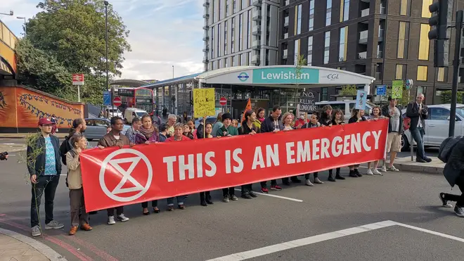 Extinction Rebellion protesters block a road in south-east London