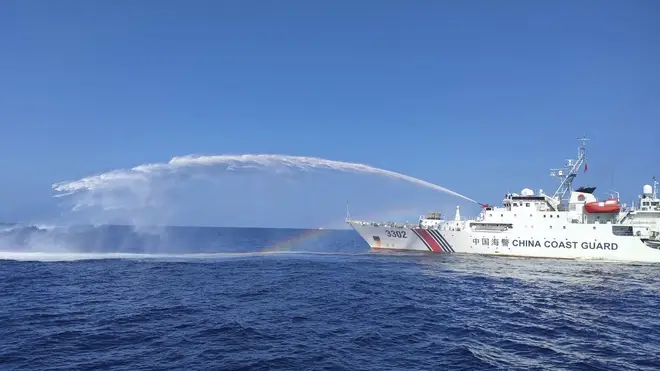 Chinese coastguard using water cannon