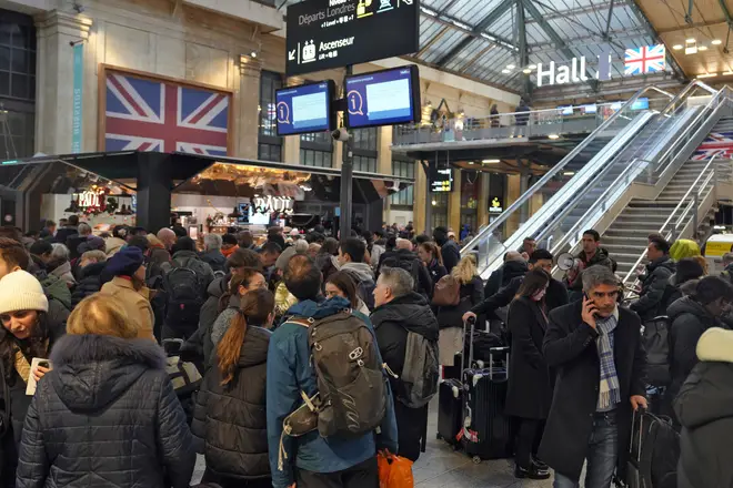Passengers wait at the Gare du Nord railway station in Paris, on December 21, 2023, as a wildcat strike by Eurotunnel workers blocked travel between France and Britain