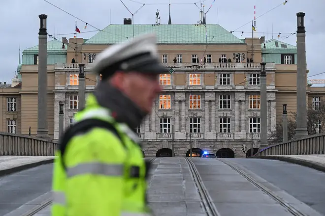 A police officer cordons off an area near the Charles University in central Prague, on December 21, 2023