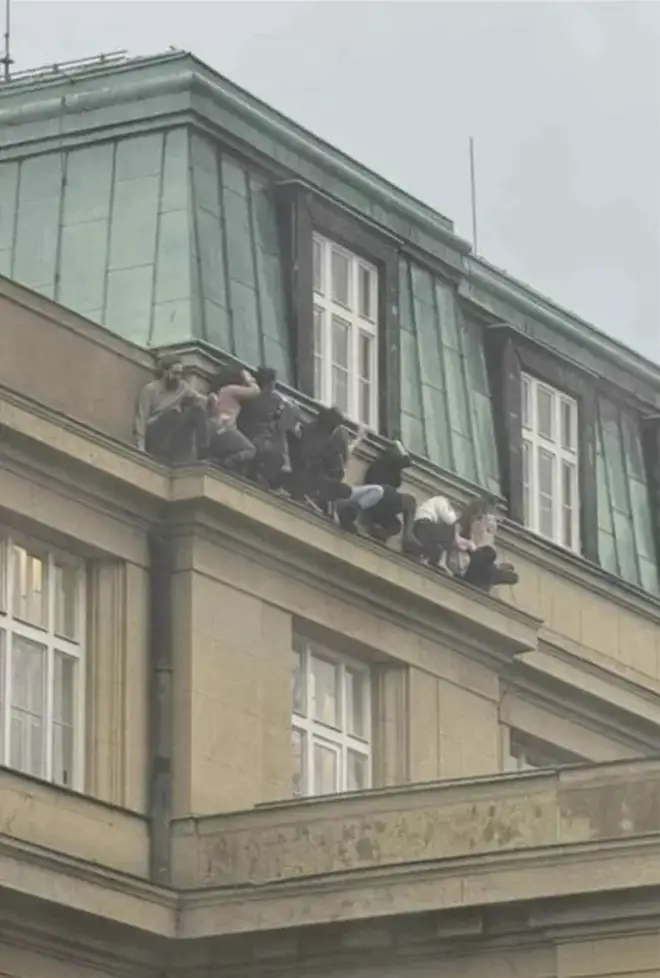 Those inside the building near Jan Palach Square in Prague's Old Town climbed out the windows to flee the gunman.