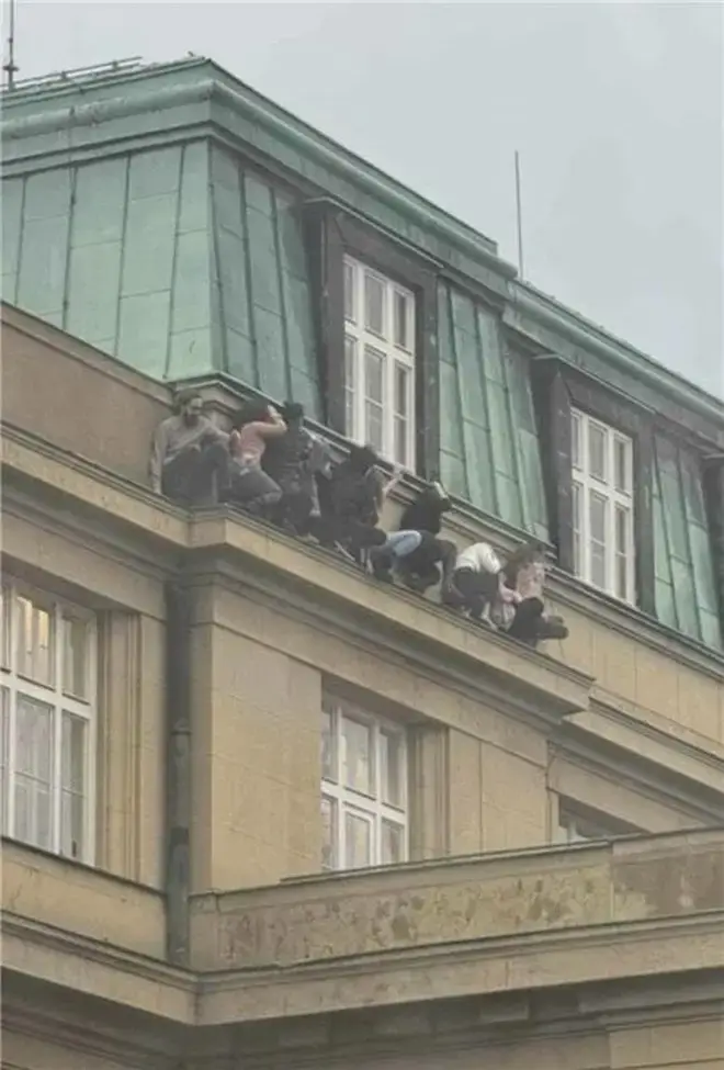Students had to cling on to the edge of the building to survive
