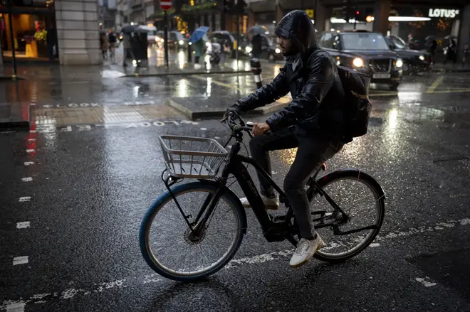 London Cyclist In The Rain
