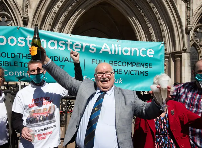Postmasters celebrate outside the High Court after their convictions were quashed in 2021.