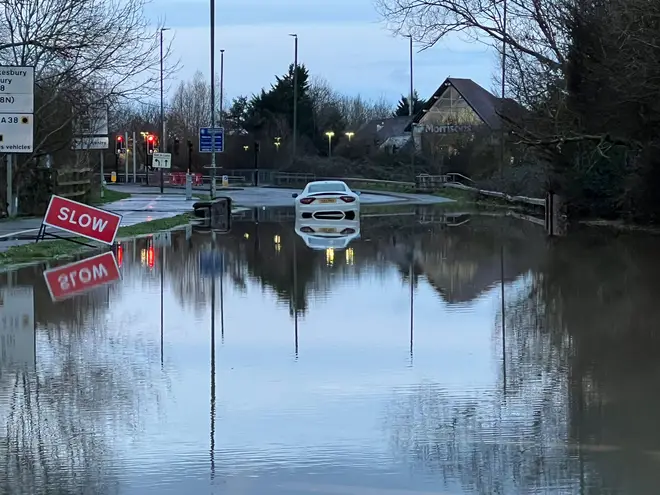 A car got stuck amid flooded Tewkesbury