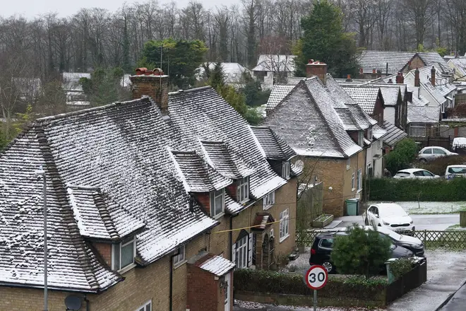 Snow covered rooftops in the village of Detling, Kent