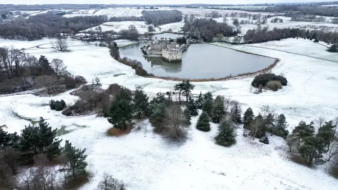 A photograph taken on January 8, 2024 shows an aerial view of Leeds Castle covered in snow in Maidstone, Kent