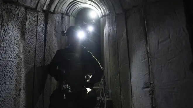 Israeli soldiers show journalists an underground tunnel where the Israeli military said it had found evidence hostages were held by militants in Khan Younis