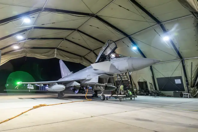 An RAF Typhoon aircraft returns to berth following a strike mission on Yemen's Houthi rebels at RAF Akrotiri on January 12