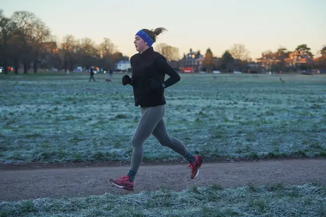 A jogger braves the cold morning on Wimbledon Common