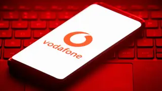 The logo of mobile phone network Vodafone is displayed on the screen of a smartphone