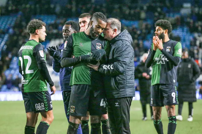 Coventry City midfielder Kasey Palmer is consoled by  Mark Robins at the end with fans gestures during the Sheffield Wednesday FC v Coventry City FC sky bet EFL Championship match at Hillsborough Stadium, 20 January 2024