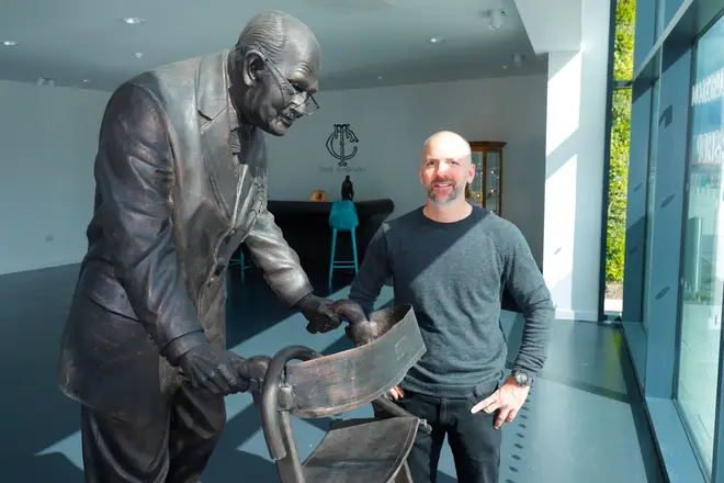 Sculptor Tony Clark with the statue of the late Captain Sir Tom Moore