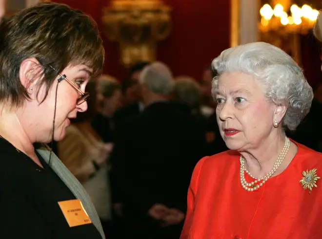 Queen Elizabeth II meets radio presenter Jenni Murray at a reception for the Women's Royal Voluntary Service at St James's Palace, March 21, 2005