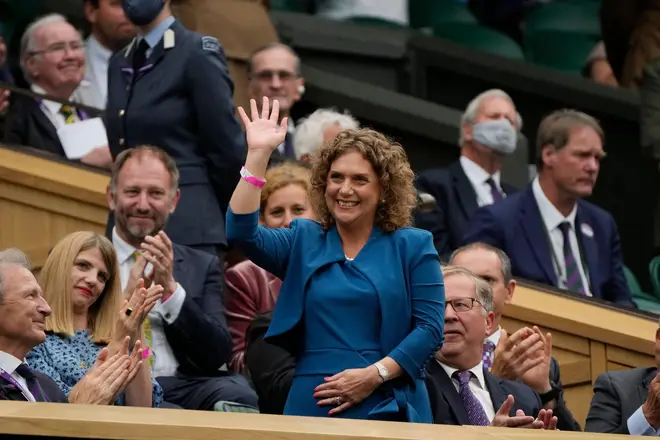 Hannah Ingram-Moore, daughter of Captain Tom Moore, waves from the Royal Box on Centre Court on day one of the Wimbledon Tennis Championships in London, Monday June 28, 2021