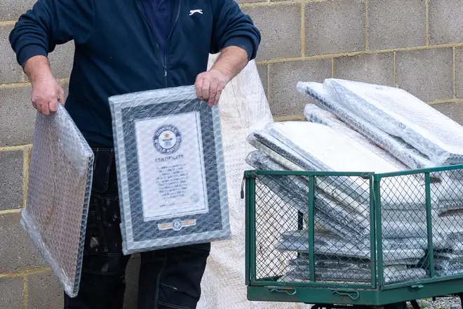 The Guinness Book of Records certificate is removed from the spa in bubble wrap