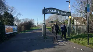 Police and Community Support Officers at the junction of the Greenway and High Street South in Newham, east London, where a newborn baby was found in a shopping bag by a dog walker.