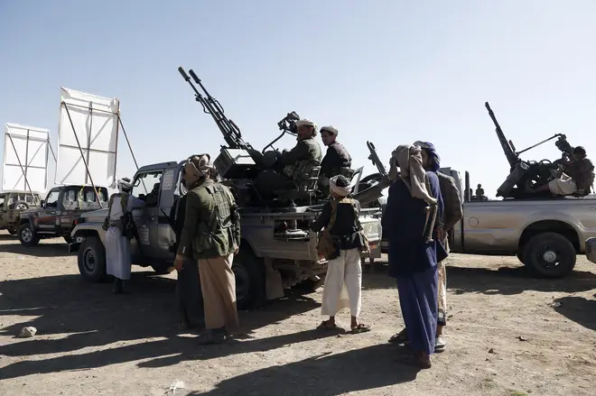 Yemen's Houthi weaponised followers ride vehicles