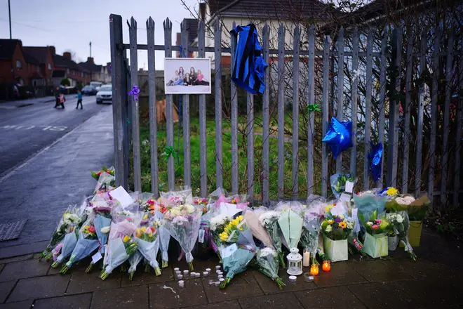 Flowers and tributes near to the scene in south Bristol where two teenage boys, aged 15 and 16, died after a stabbing attack by a group of people who fled the scene in a car