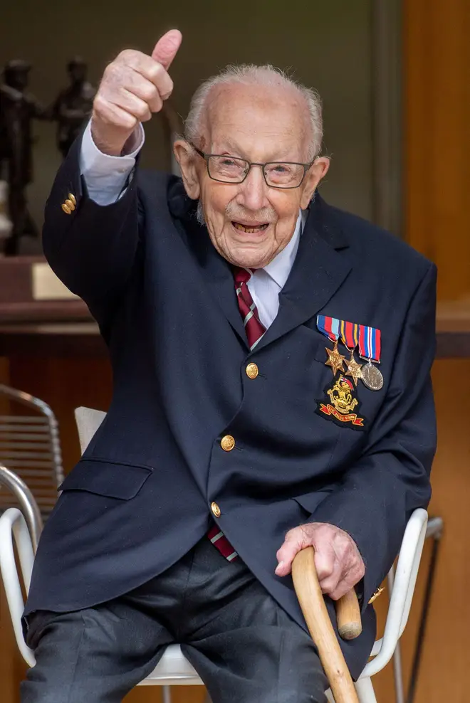 British veteran Captain Tom Moore thumbs up and smiles in Bedfordshire