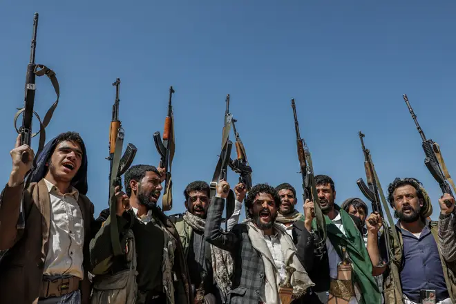 Armed rebels of the Iran-backed Houthi militia take part in a demonstration against the USA and Israel following the operations in the Red Sea, January 24