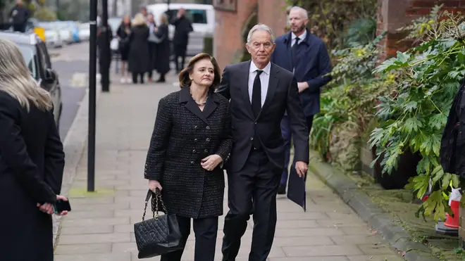 Former prime minister Tony Blair and his wife Cherie Blair