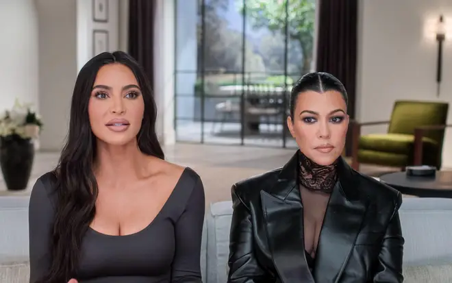 Kourtney Kardashian and Kim Kardashian in a scene from the reality show The Kardashians