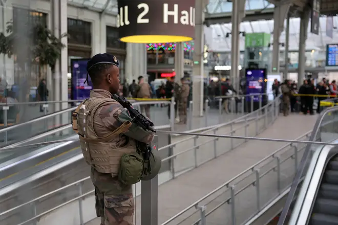 A French soldier of the Sentinelle security operation stands guard in a hall after a knife attack at Paris's Gare de Lyon railway station.