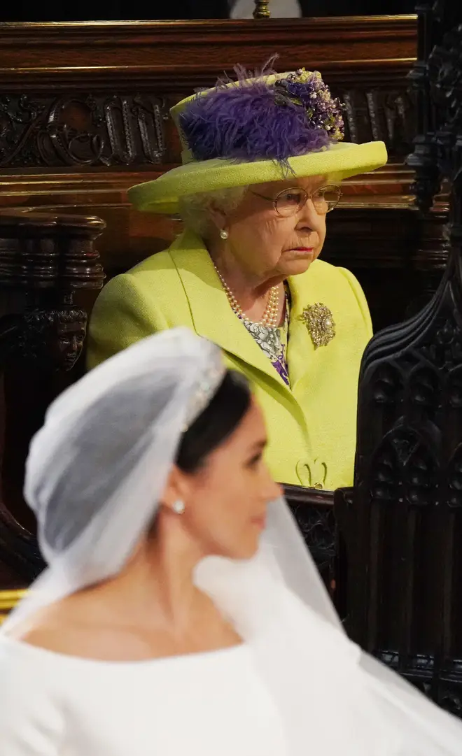 The monarch confided her view on Meghan's dress to her cousin