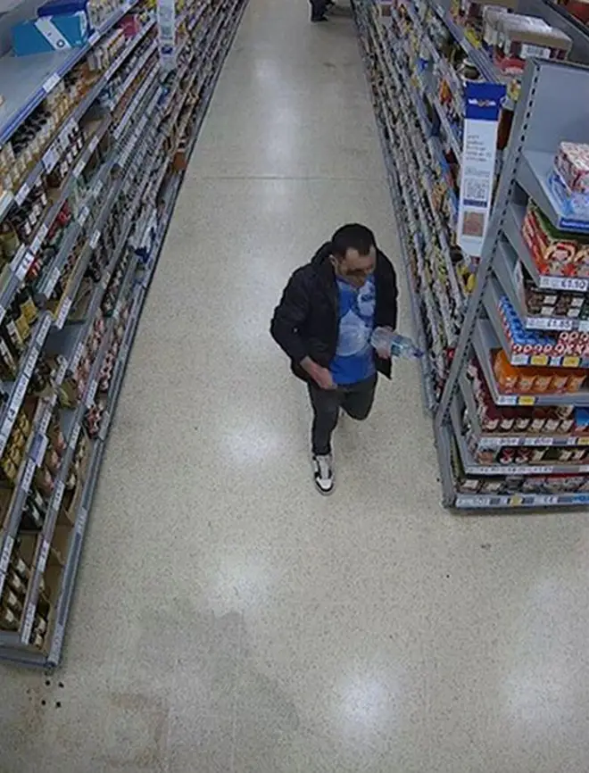 Handout CCTV image dated 31/01/24 issued by the Metropolitan Police of Abdul Ezedi, the suspect in the Clapham alkaline substance attack, at a Tesco on Caledonian Road