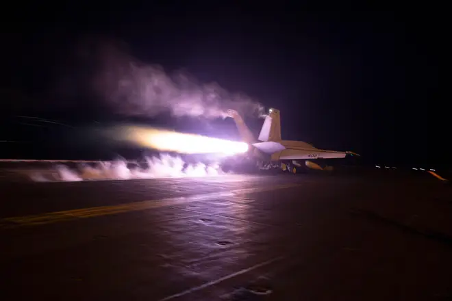 This image provided by the U.S. Navy shows an aircraft launching from USS Dwight D. Eisenhower (CVN 69) during flight operations in the Red Sea