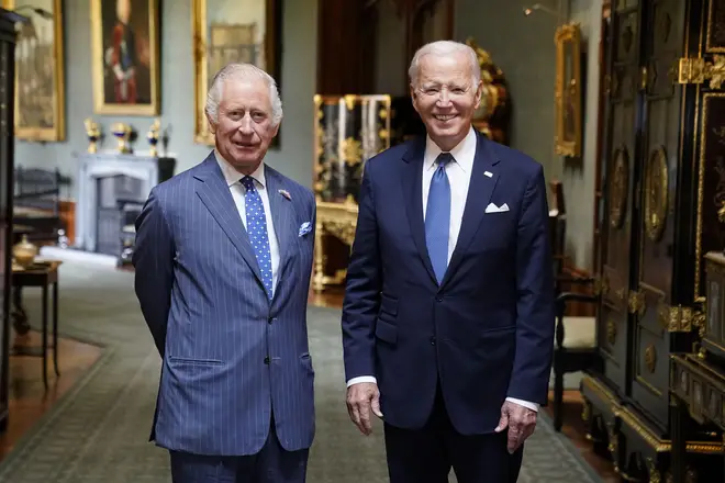 King Charles III and US President Joe Biden in the Grand Corridor at Windsor Castle, Berkshire, during the state visit to the UK