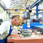 A mechanical engineer works in an industrial factory. Experts suggest the UK pension age could rise to 71