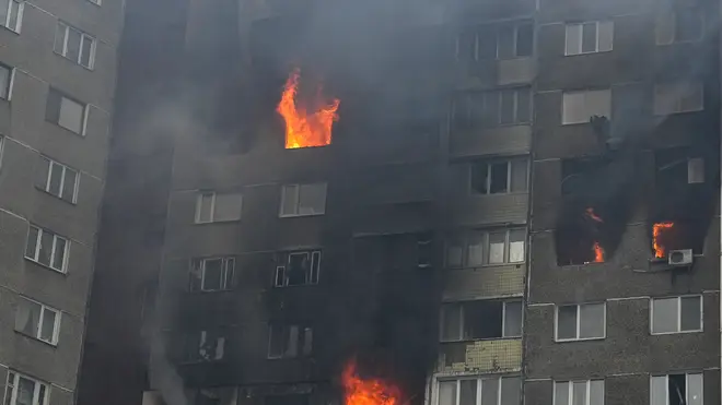 Fire and smoke rise out of an apartment building after a Russian attack in Kyiv, Ukraine