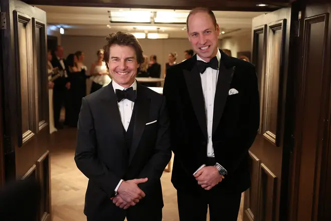 Prince William poses for a photo with US actor Tom Cruise at the London Air Ambulance Charity Gala Dinner