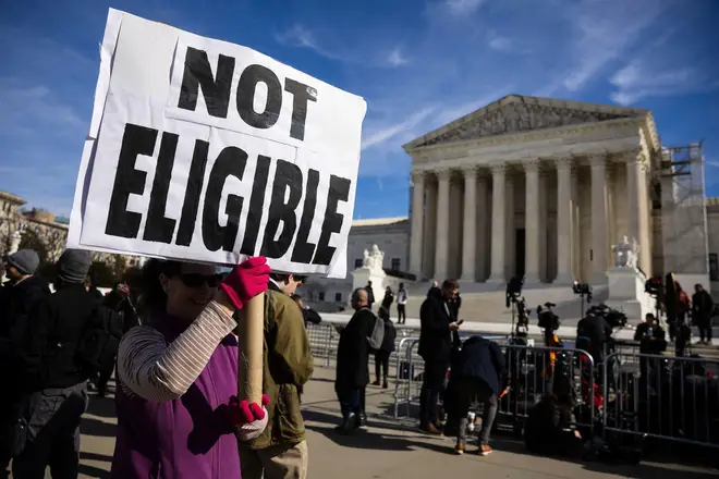 Demonstrators are seen outside the U.S. Supreme Court in Washington, D.C., Thursday