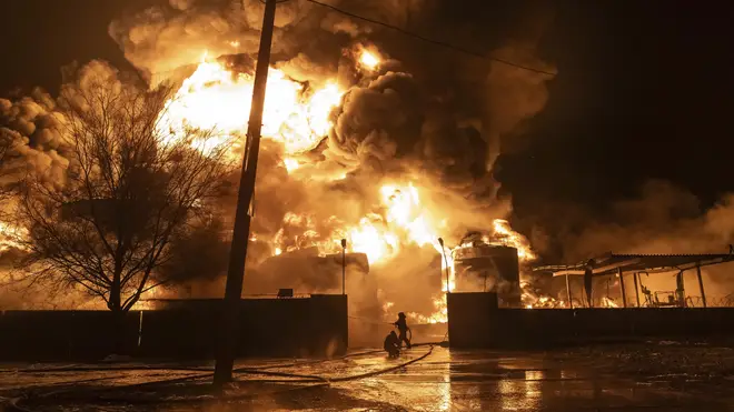 Firefighters tackle a blaze after a Russian attack on Kharkiv