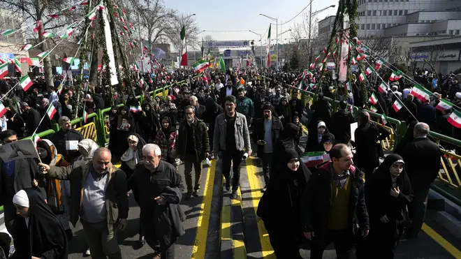 Iranians attend a rally in Tehran commemorating the 1979 Islamic Revolution