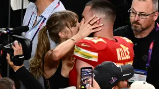 US singer-songwriter Taylor Swift kisses Kansas City Chiefs' tight end #87 Travis Kelce after the Chiefs won Super Bowl LVIII against the San Francisco 49ers at Allegiant Stadium in Las Vegas